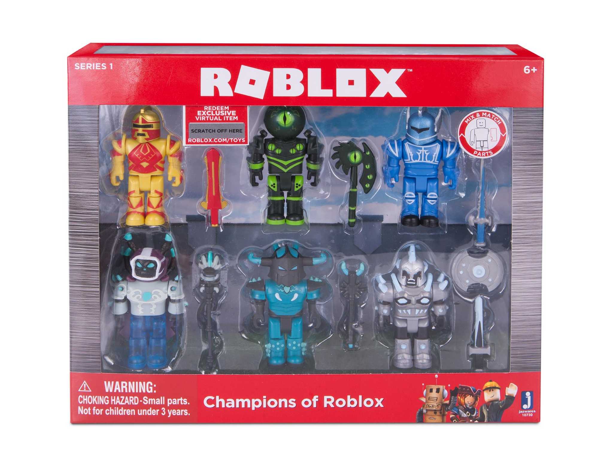 CEO David Baszucki (right) of Roblox gives the creative product team their  first view of the packaging for their new release of a line of physical  toys coming early next month, designed