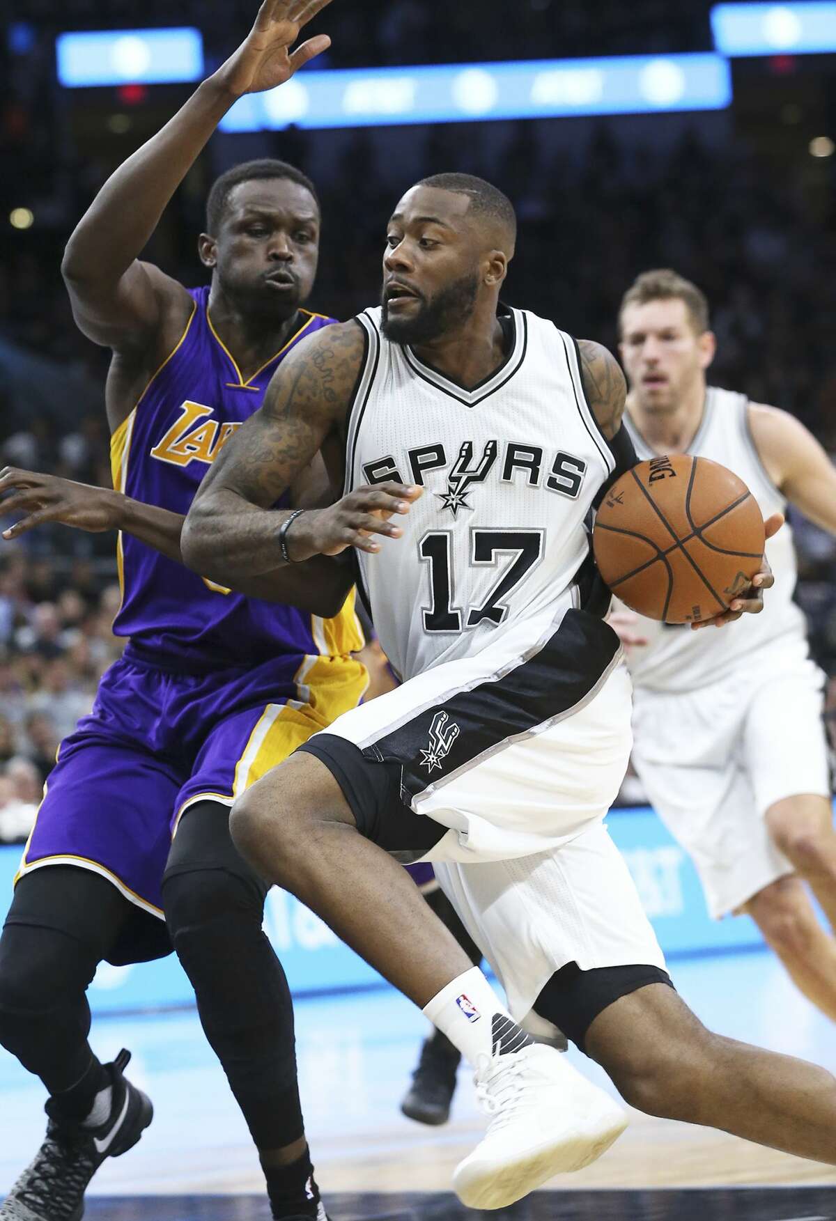 Jonathon Simmons streaks to the hoop in the first half against Luol Deng as the Spurs host the Lakers at the AT&T Center on January, 12, 2017.