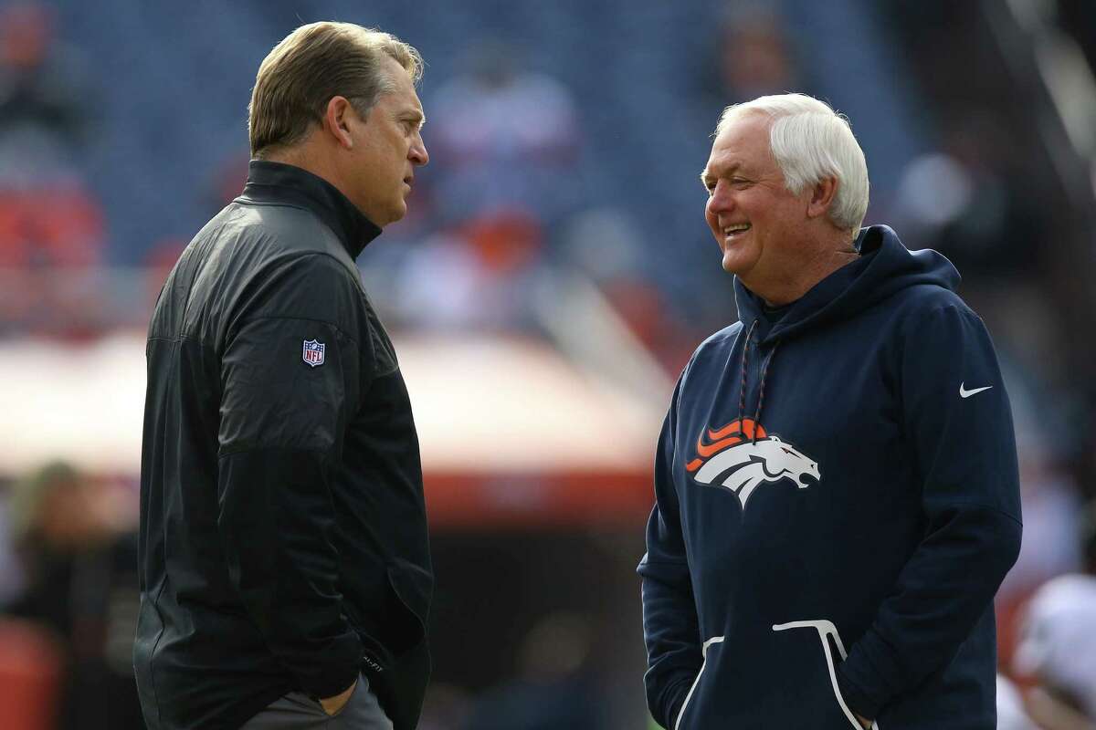DENVER, CO - JANUARY 1: Defensive coordinator Wade Phillips of the Denver Broncos talks to head coach Jack Del Rio of the Oakland Raiders before the game at Sports Authority Field at Mile High on January 1, 2017 in Denver, Colorado. (Photo by Justin Edmonds/Getty Images)
