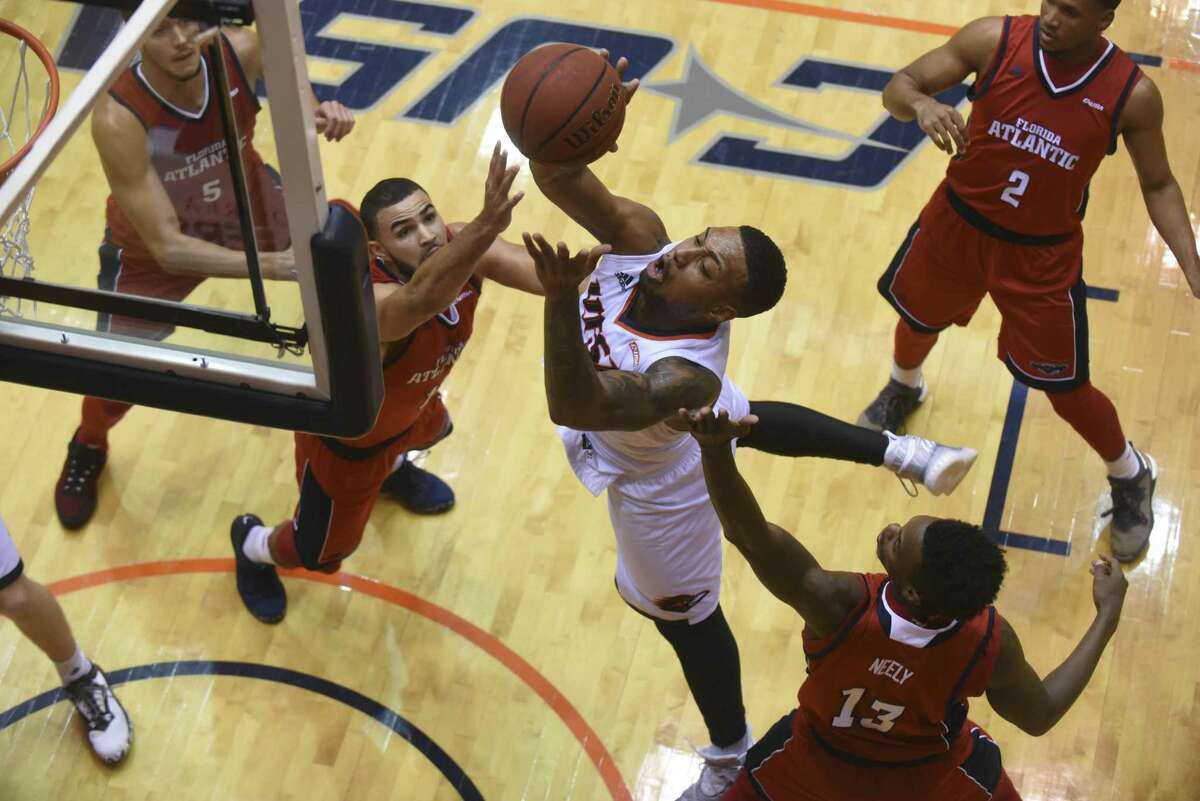 UTSA's Jeff Beverly shoots against a quartet of Florida Atlantic defenders during college basketball action in the UTSA Convocation Center on Thursday, Jan. 12, 2017.