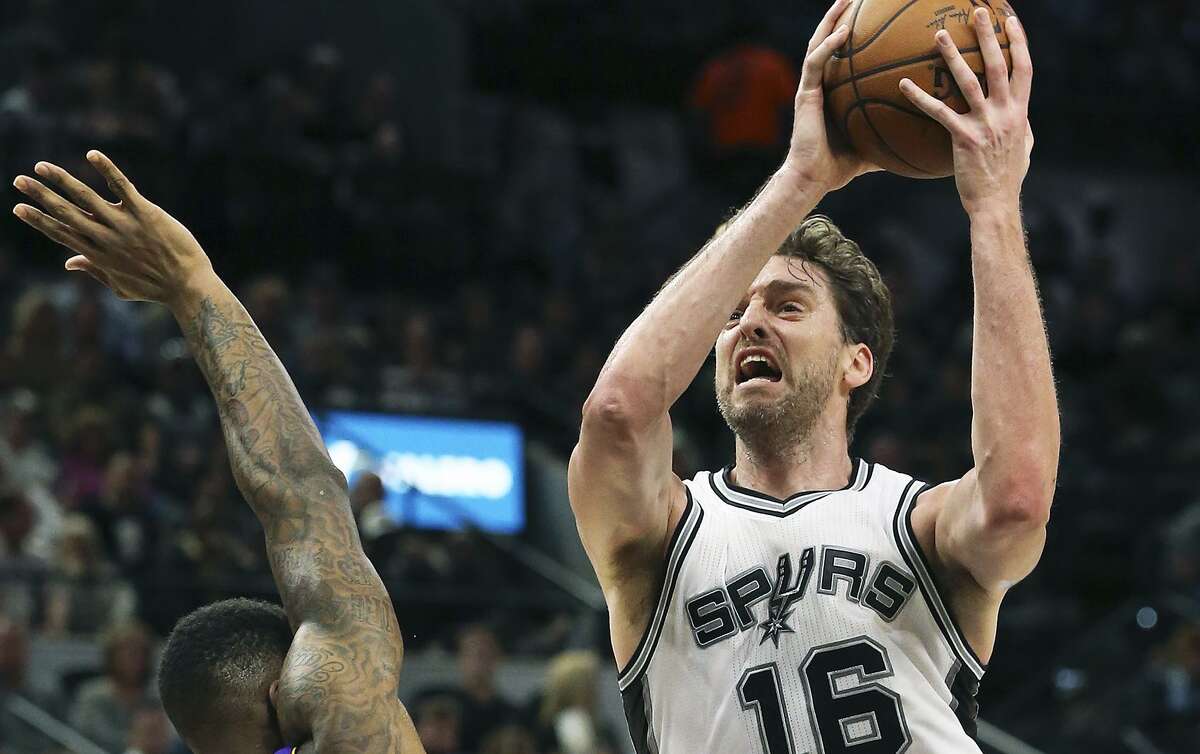 Pau Gasol heads to the basket for a shot against Thomas Robinson in the first half as the Spurs host the Lakers at the AT&T Center on Jan. 12, 2017.