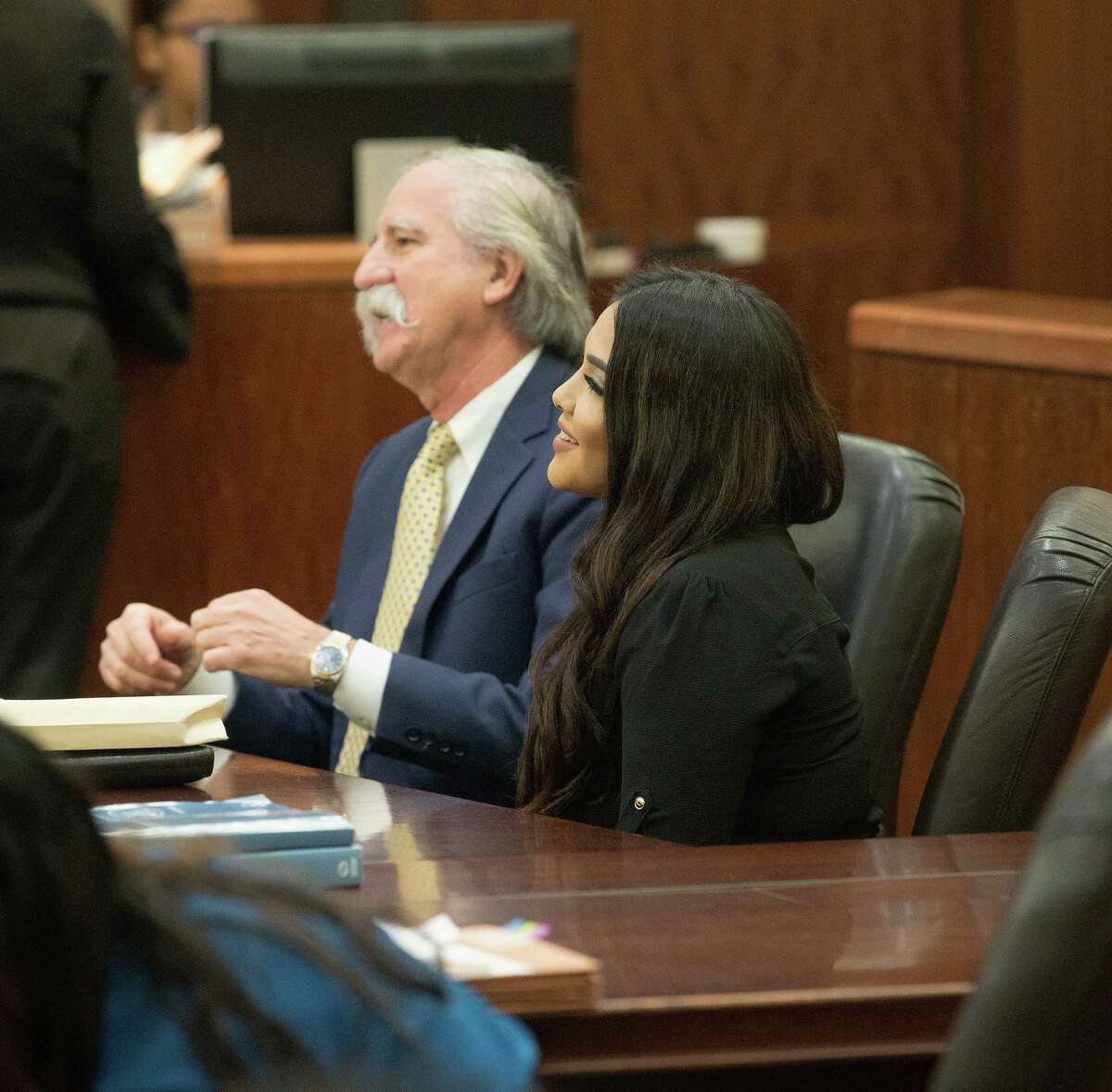 Alexandria Vera, 24, a former Aldine ISD teacher arrives sits with her attorney Ricardo Rodriguez as they wait for her hearing to begin. Vera accepted a charge of aggravated sexual assault of a child, which has a maximum sentence of life in prison. However, under the plea deal, her possible punishment is capped at 30 years and she is eligible for deferred adjudication probation.