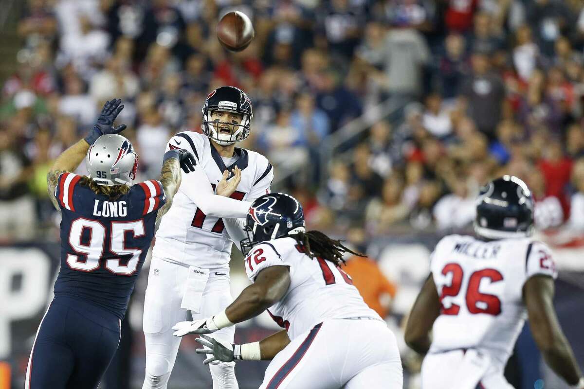 Houston Texans quarterback Brock Osweiler throws a pass over New England Patriots defensive end Chris Long (95) during the second quarter at Gillette Stadium on Sept. 22, 2016, in Foxborough, Mass.