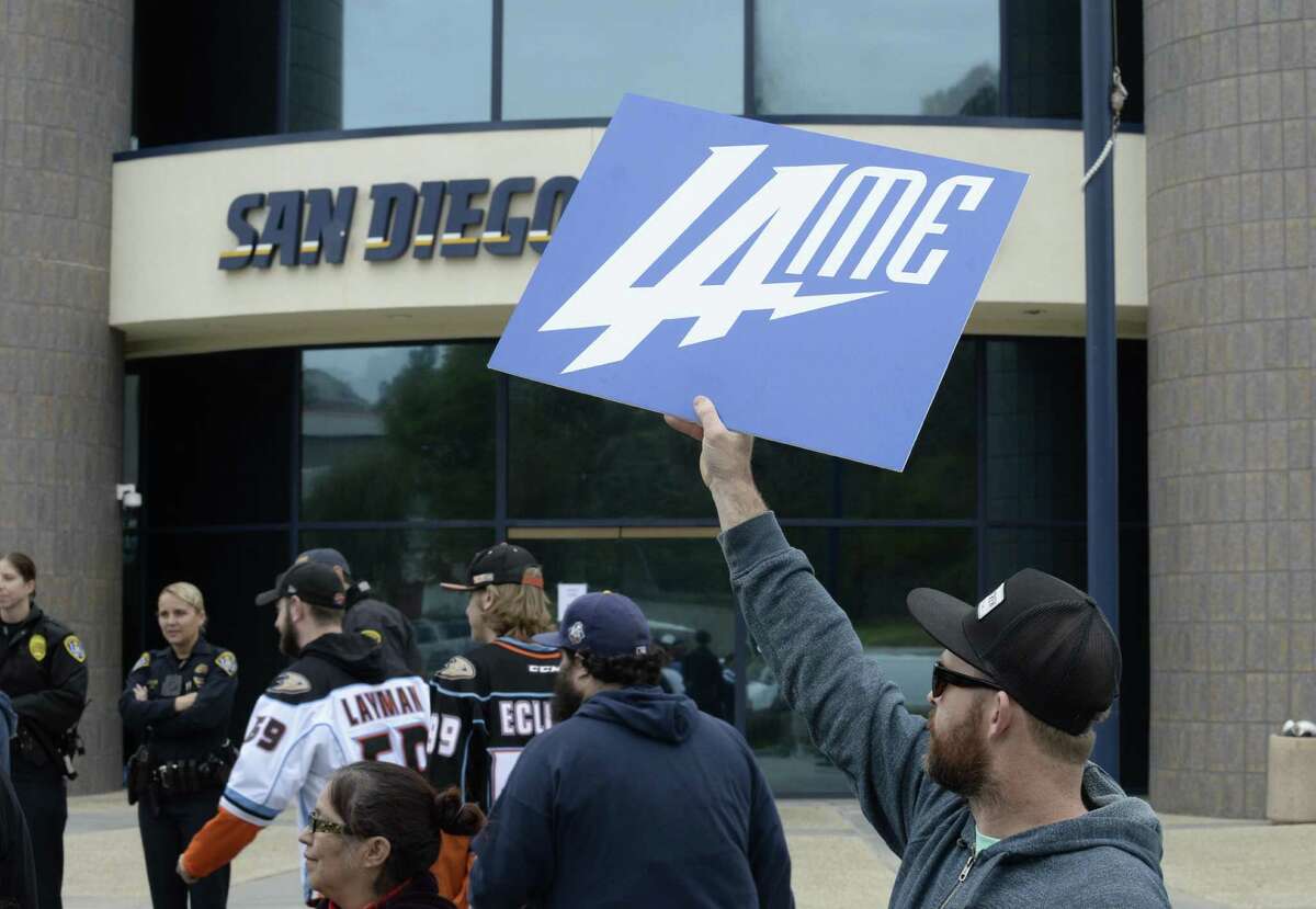 A San Diego Chargers fan holds up a sign in front of Chargers headquarters after the team announced that it will move to Los Angeles on Jan. 12, 2017, in San Diego.