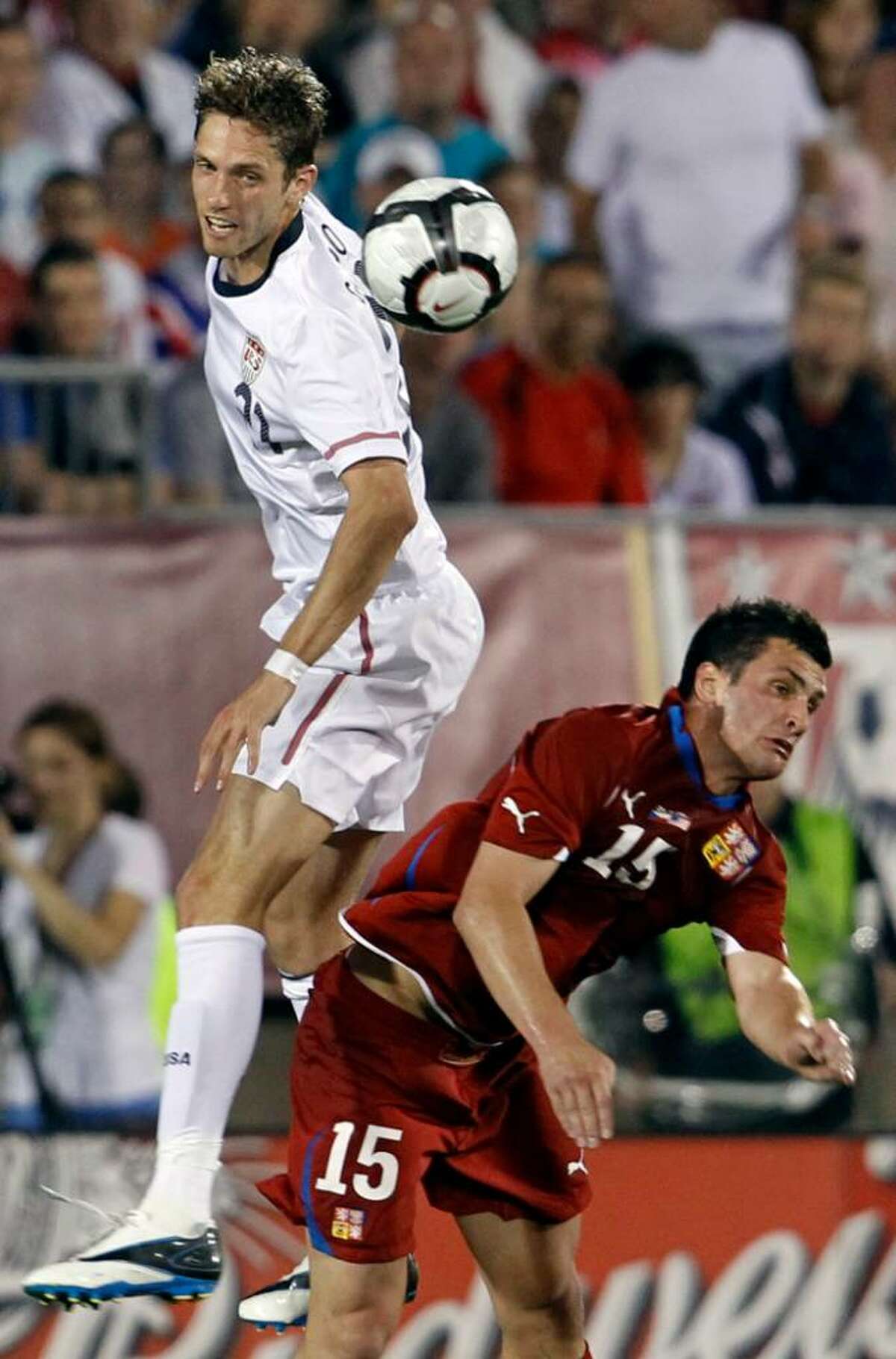 United States' Clarence Goodsen, left, heads the ball against Czech Republic's Martin Fenin (15) during the first half of an international friendly soccer match in East Hartford, Conn., Tuesday, May 25, 2010. The Czech Republic won 4-2.