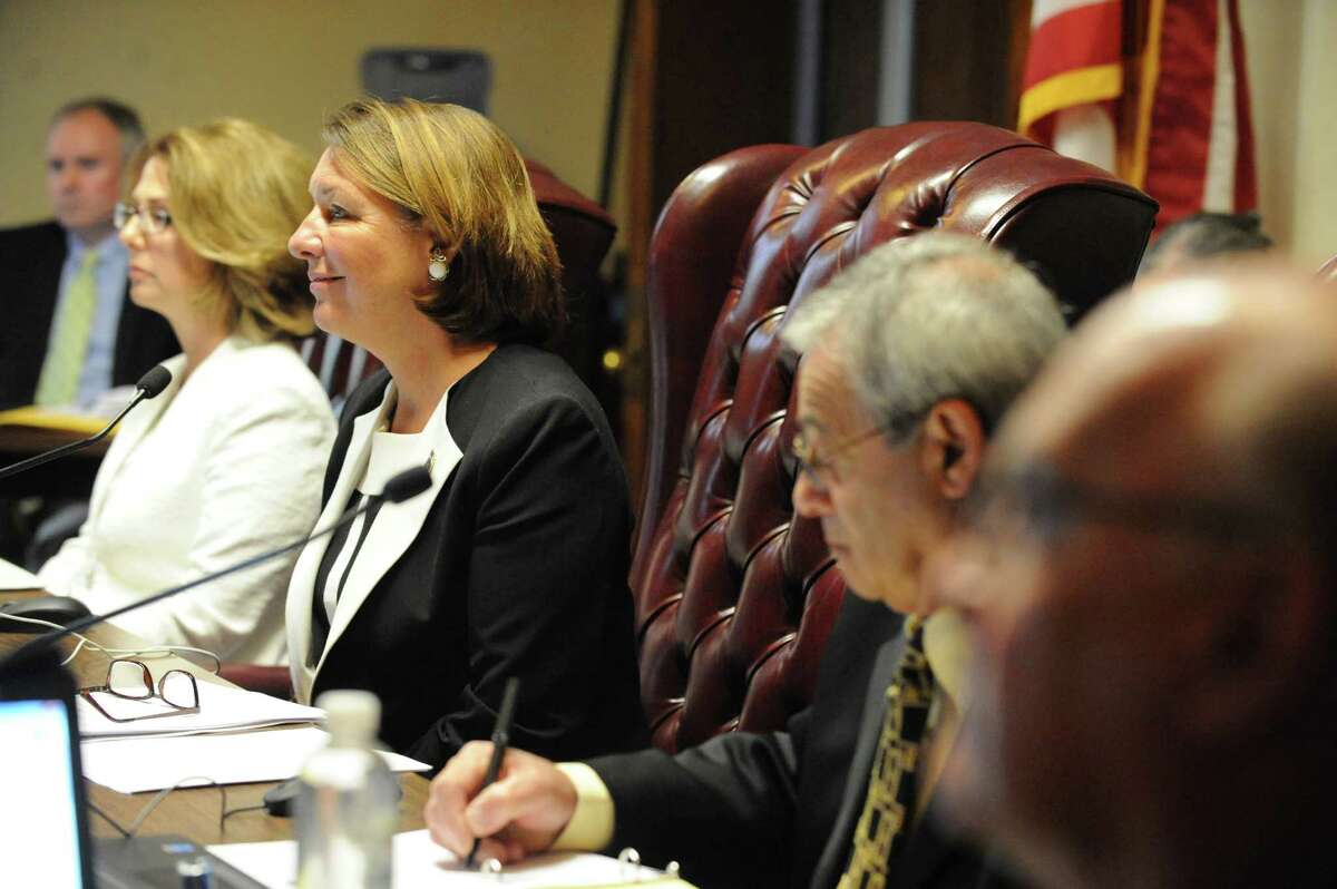 Saratoga Springs commissioners, including Finance Commissioner Michelle Madigan (at left in white) and Mayor Joanne Yepsen at a public hearing in 2016 at Saratoga Springs City Hall. (Times Union Archive)