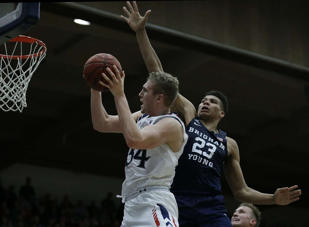 Saint Mary's Jock Landale, left, shoots against BYU forward Yoeli Childs (23) during the second half of an NCAA college basketball game Thursday, Jan. 5, 2017, in Moraga, Calif. (AP Photo/Ben Margot)