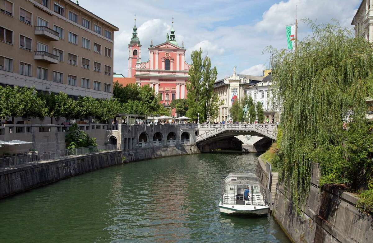 Ljubljana, with its Tromostovje bridge, is among towns in Slovenia that are in the midst of a tourism boom.