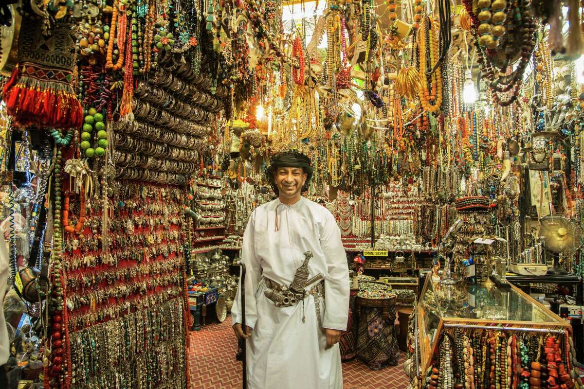 A merchant in the souk, or marketplace, offers his wares in Oman's capital city, Muscat.