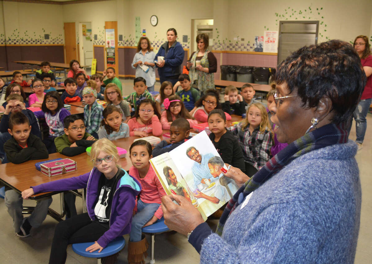 Remembering MLK Doug McDonough/Plainview Herald Runningwater Draw RSVP volunteer Emma Herring reads a book about Dr. Martin Luther King Jr. to second grade students at La Mesa Elementary on Friday. RSVP joined with Hale County Literacy Council and Wayland Baptist University during a special assembly on Friday to tell students about the civil rights leader and to encourage them to fellow their own dream. “Although Monday is a national holiday, and a day off for many,” said retired educator Alfred Henderson, “instead of a day off, it should be a day of service to benefit others. That’s an appropriate way to honor Dr. King’s memory.” The participating organizations visit a different school each year with a special message about Martin Luther King Jr. Last year, according to RSVP Director Irma Shackelford, they shared the story of Dr. King with students at Highland Elementary.