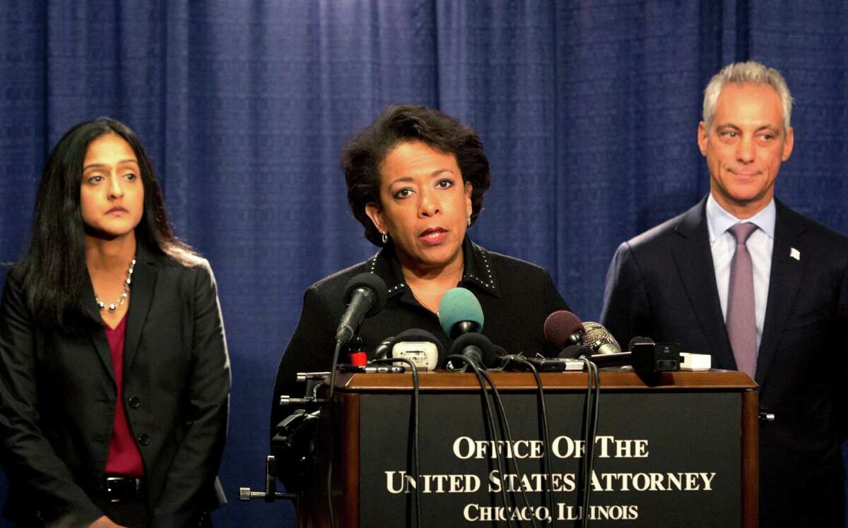 Attorney General Loretta Lynch speaks during a news conference accompanied by Principal Deputy Assistant Attorney General Vanita Gupta, left, and Chicago Mayor Rahm Emanuel Friday, Jan. 13, 2017, in Chicago. The U.S. Justice Department issued a scathing report on civil rights abuses by Chicago's police department over the years. The report released Friday alleges that institutional Chicago Police Department problems have led to serious civil rights violations, including racial bias and a tendency to use excessive force. (AP Photo/Teresa Crawford)