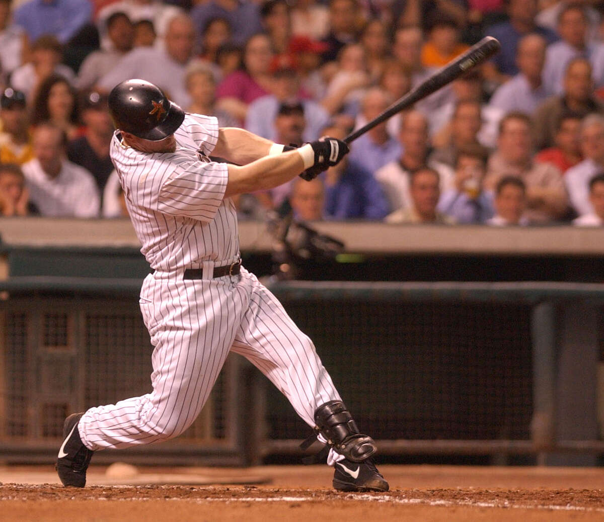 Jeff Bagwell powers the ball into left field on a triple in the 4th inning, during the Houston Astros-Florida Marlins game at Minute Maid Park in 2002.
