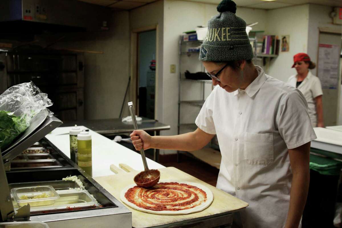 Andrea Ledesma, who has a four-year degree, works at Classic Slice restaurant in Milwaukee.