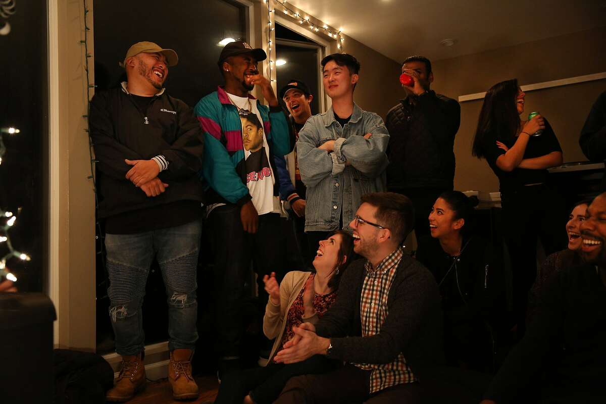 Audience members laugh during the "Alien Family" performance during a Sofar Sounds concert on Friday, Jan. 13, 2017, in San Francisco, Calif. The concert was held at a house in the Twin Peaks neighborhood. The exact venue location is a secret, as is the talent scheduled to perform until the day of the concert.