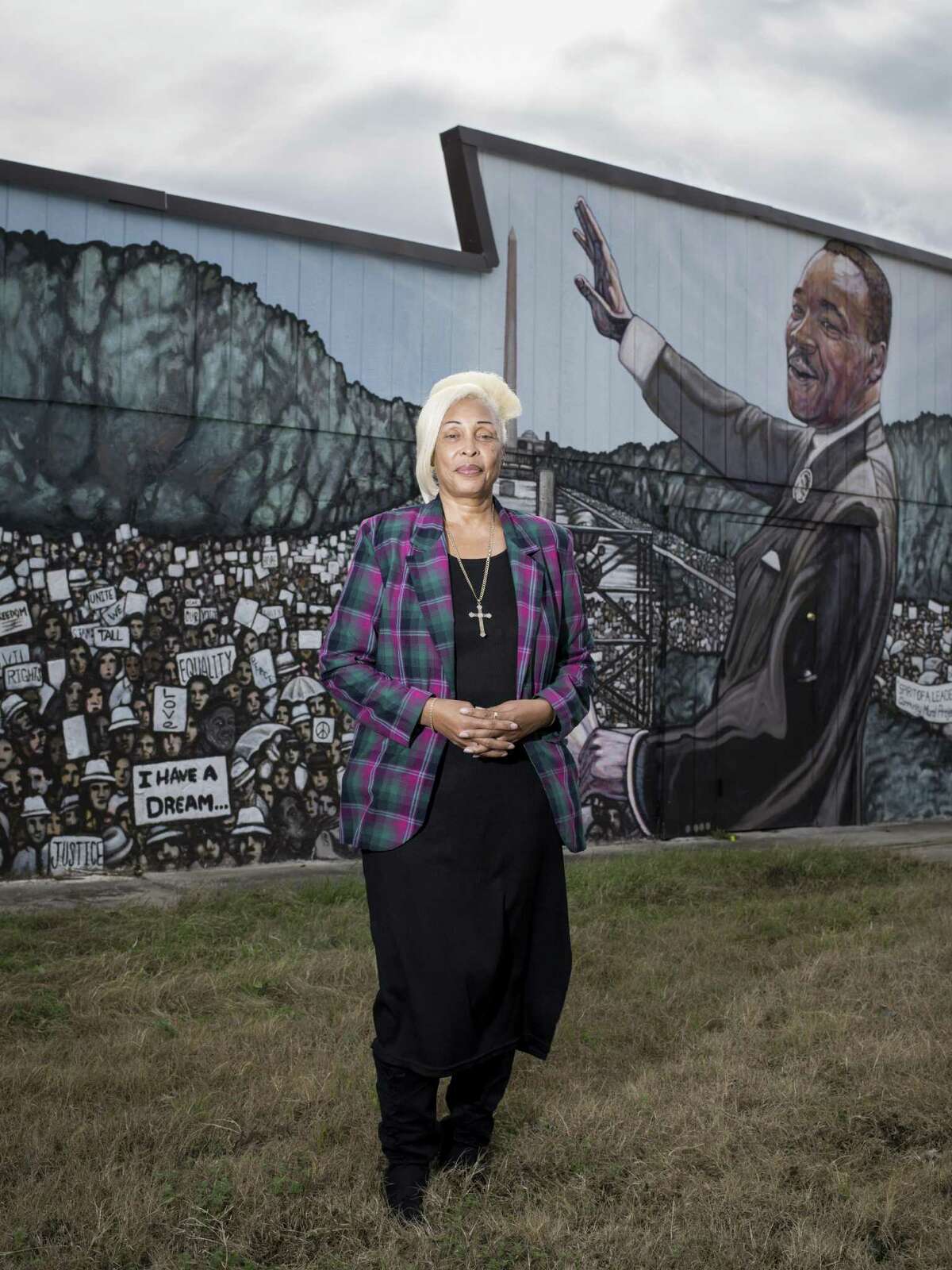 Rosa L. Wilson, pastor of the Greater Faith Institutional Church poses for a portrait in front of the church's mural of Martin Luther King Jr. on Saturday, January 14, 2017 in San Antonio, Texas.