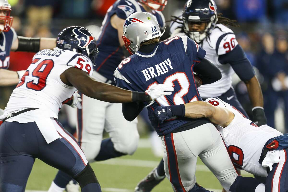 Houston Texans outside linebacker Whitney Mercilus (59) and inside linebacker Brian Cushing (56) sack New England Patriots quarterback Tom Brady (12) during the second quarter of an AFC Divisional Playoff game at Gillette Stadium on Saturday, Jan. 14, 2017, in Foxborough. ( Brett Coomer / Houston Chronicle )