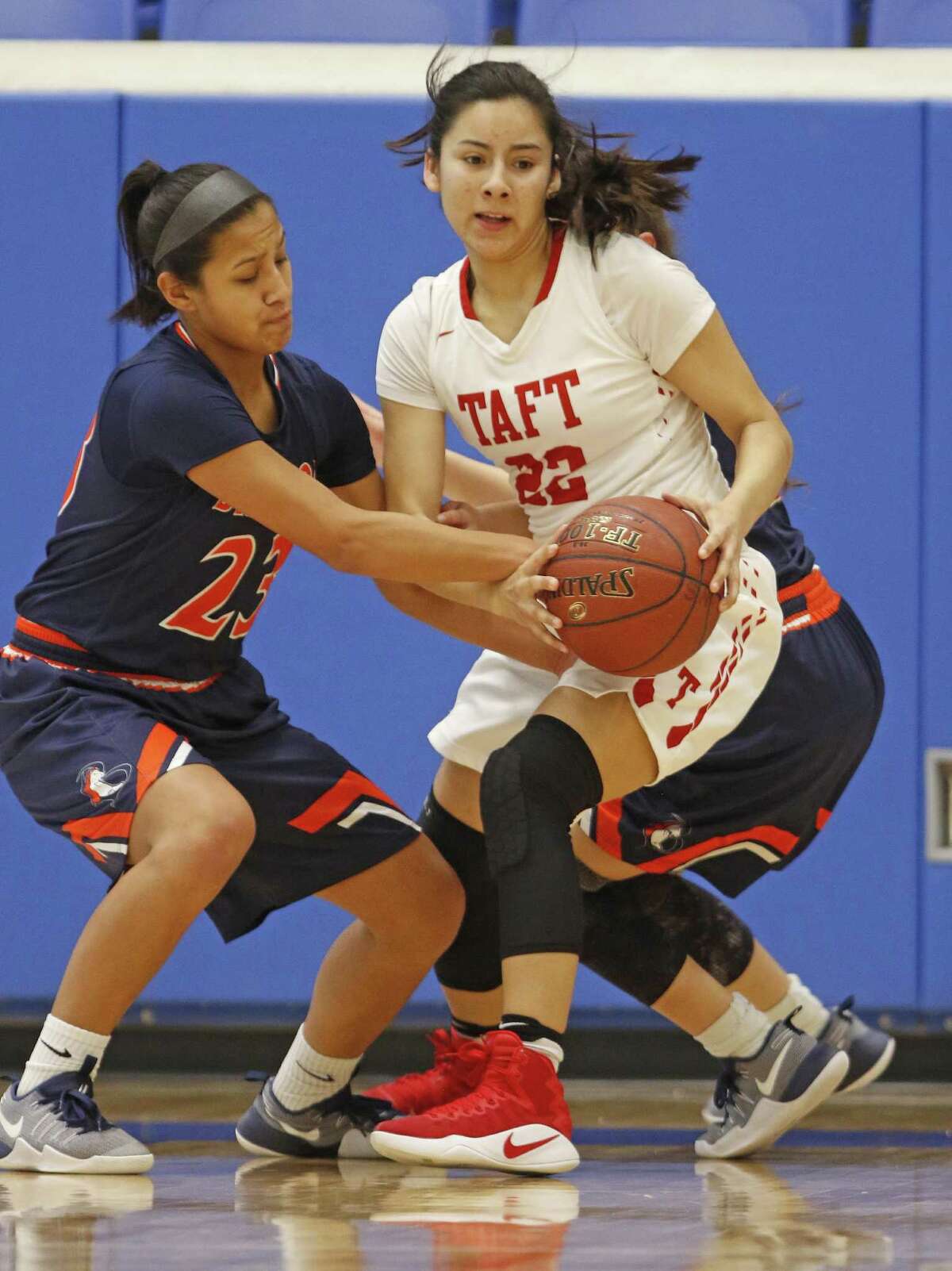 Brandeis?•s Ariana Villa tries to tie up Taft?•s Brianna Cuellar in the District 28-6A girls basketball game on Saturday, January 14, 2017 at Northside ISD Gym.