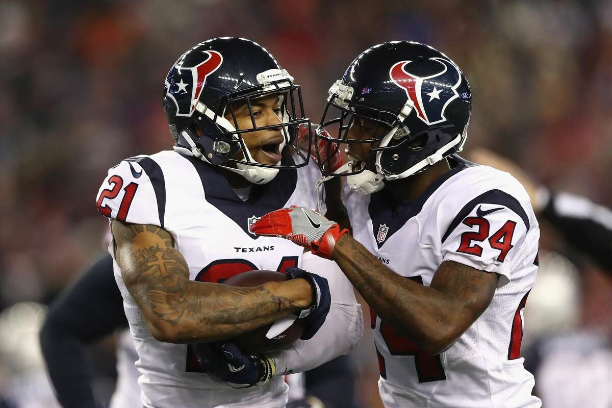 FOXBORO, MA - JANUARY 14: A.J. Bouye #21 of the Houston Texans celebrates with Johnathan Joseph #24 after an interception in the second quarter against the New England Patriots during the AFC Divisional Playoff Game at Gillette Stadium on January 14, 2017 in Foxboro, Massachusetts. (Photo by Elsa/Getty Images)