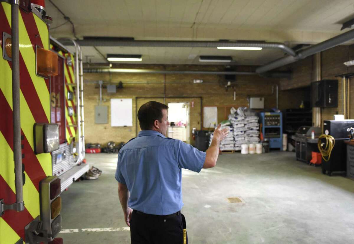 Fire Lt. Matt Brooks points out building issues at the Byram Volunteer Fire Department in the Byram section of Greenwich, Conn. Thursday, Jan. 12, 2017. The building suffers from run down conditions, including a rat problem, ceiling tiles falling down, crack in the floor and other general age issues.