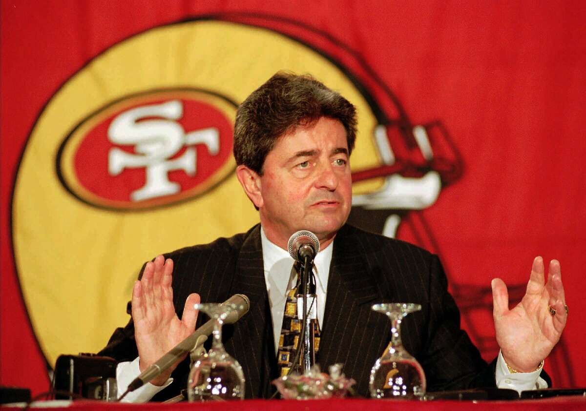FILE -- San Francisco 49ers president and chief executive officer Carmen Policy answers questions during a news conference in Santa Clara, Calif., in this Dec. 3, 1997 photo. Policy is out as the San Francisco 49ers' president, and his replacement could be Bill Walsh, whose decade-long stay as coach coincided with the team's rise to power in the NFL. (AP Photo/Paul Sakuma)
