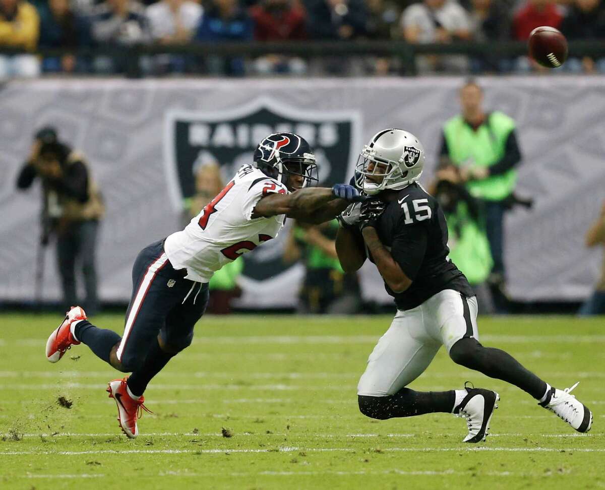 Houston Texans cornerback Johnathan Joseph (24) breaks up a pass intended for Oakland Raiders wide receiver Michael Crabtree (15) on a Raiders fourth down during the second quarter of an NFL football game at Estadio Azteca on Monday, Nov. 21, 2016, in Mexico City. ( Brett Coomer / Houston Chronicle )