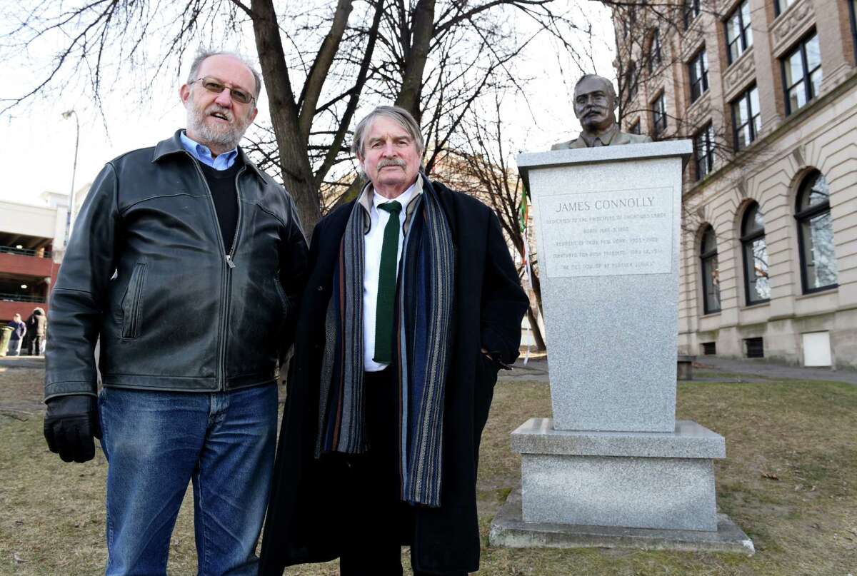Michael Barrett, left, and Denis Foley, right, stand next to the James Connolly Memorial in Riverfront Park on Monday, Jan. 16, 2017, in Troy, N.Y. The pair are making a documentary film about the famed Irish revolutionary leader who once lived in Troy. Foley is the films' screenwriter and director with Barrett working as historical consultant. (Will Waldron/Times Union)