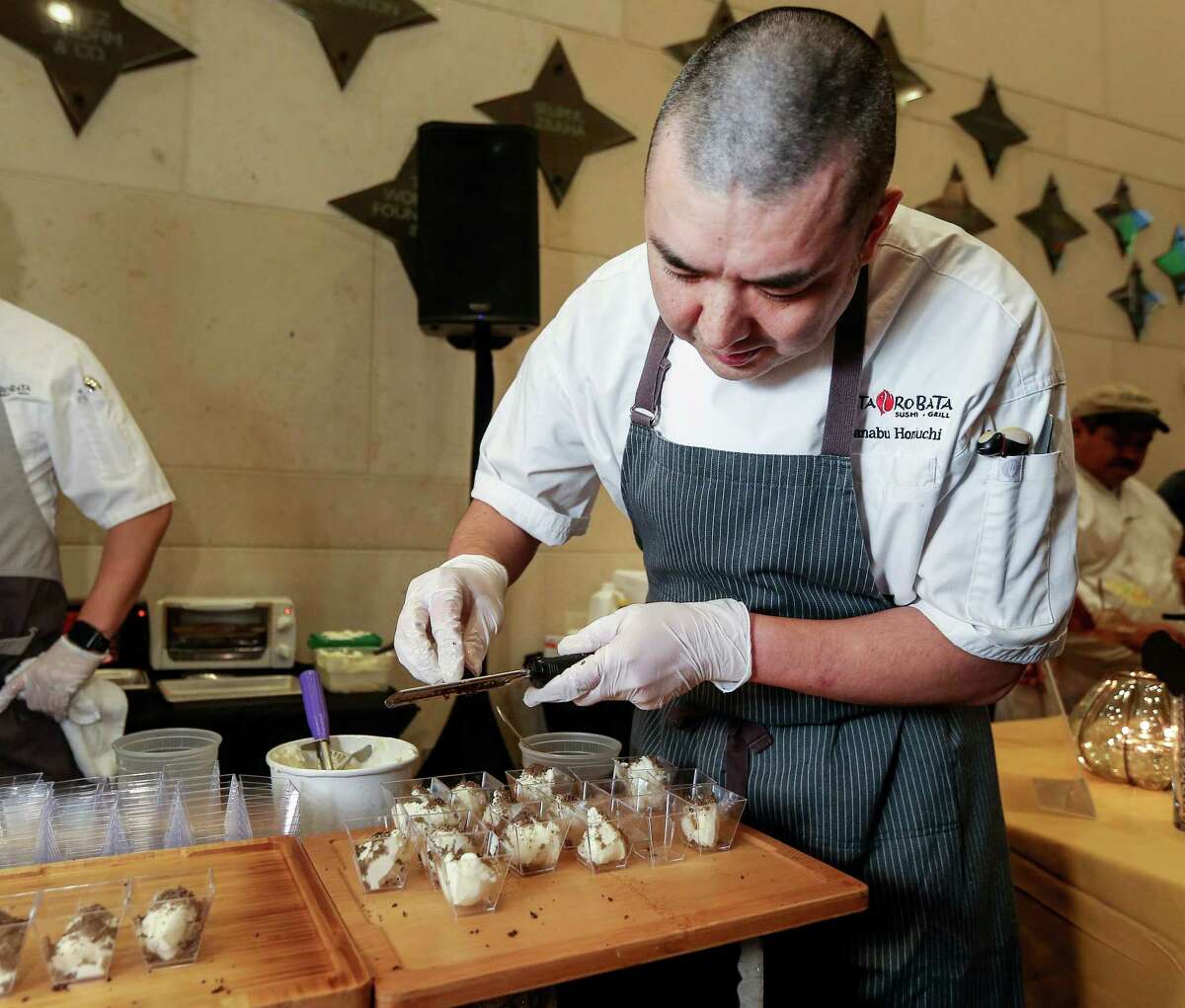 Manabu Horiuchi, the executive chef from Kata Robata, prepares honey truffle ice cream at Truffle Masters 2017, at the Hobby Center. Horiuchi won first place; he also created an open face truffle banh mi sandwich.