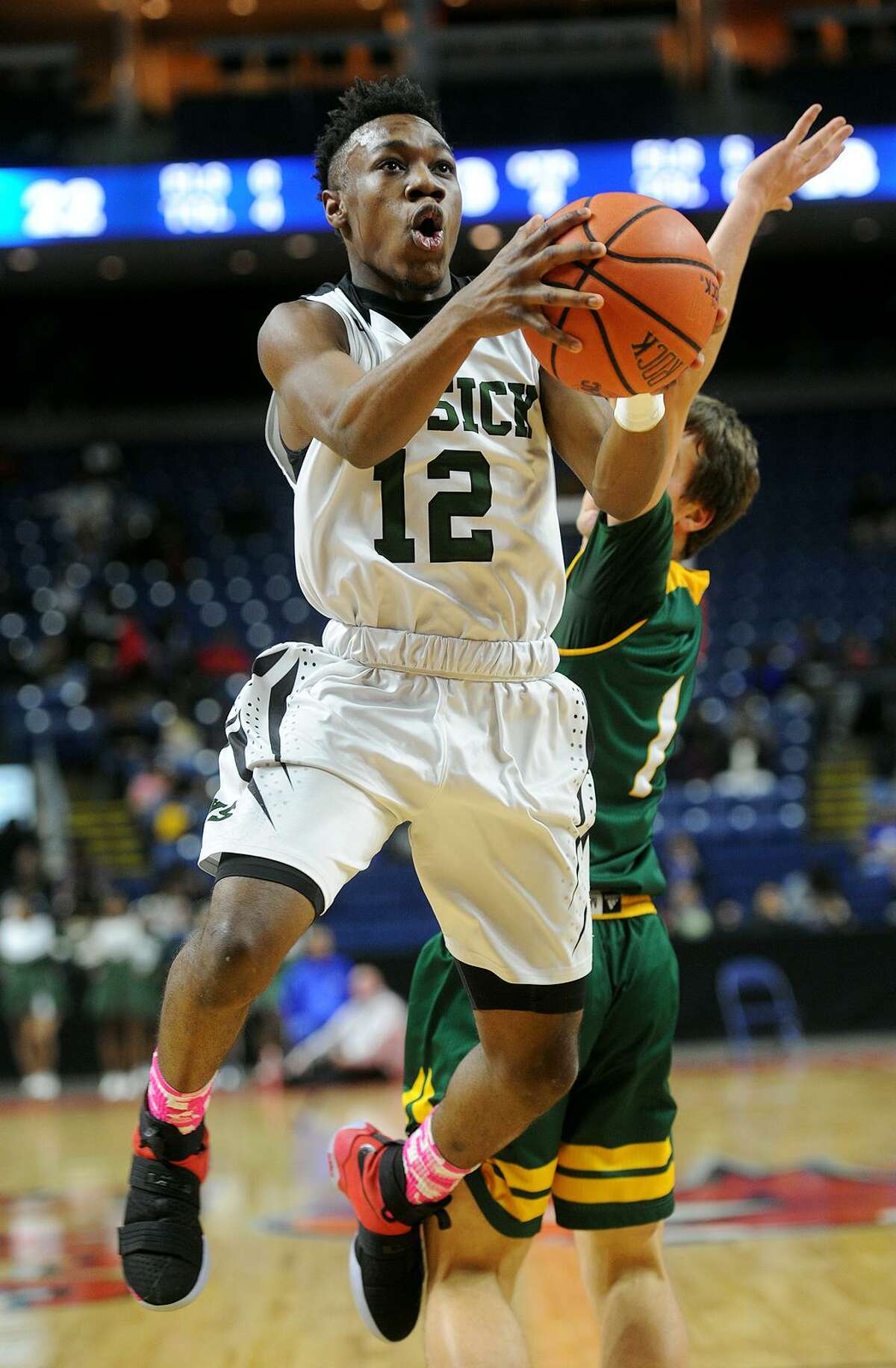 Bassick’s Qualon Wilkes drives to the basket during his team's game with Hamden in the third annual MLK Ali Classic at the Webster Bank Arena in Bridgeport on Monday.