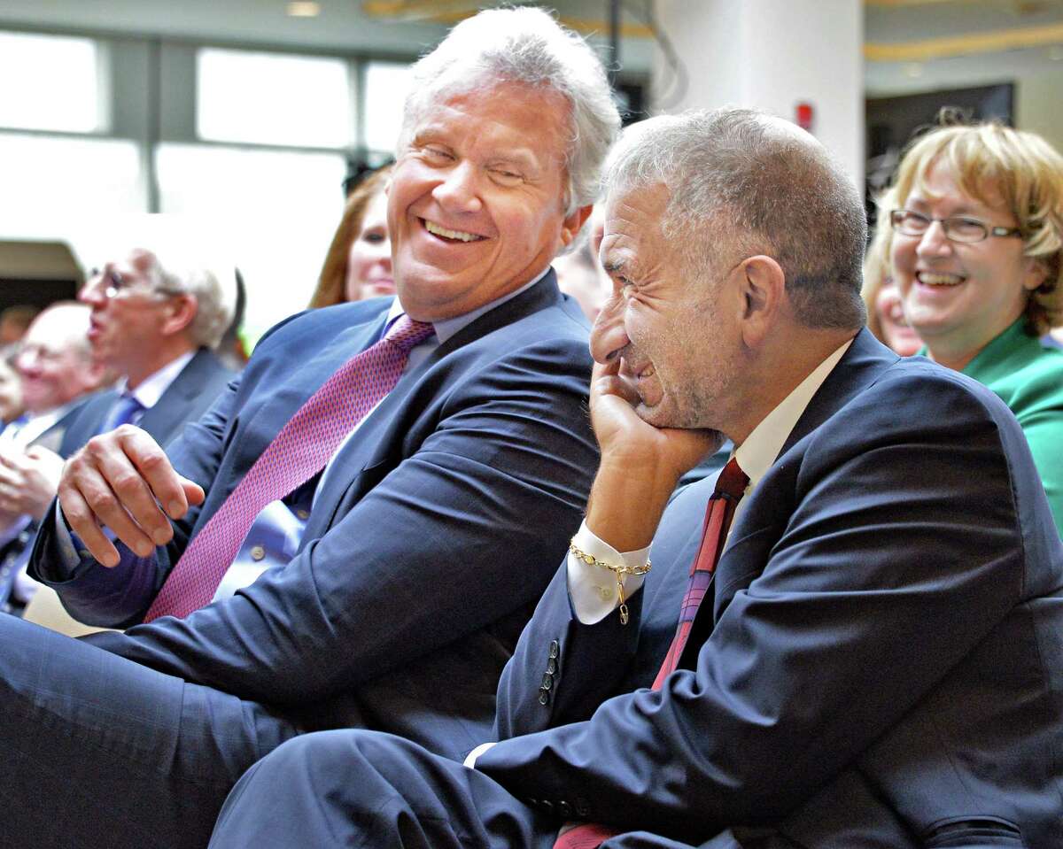 GE CEO Jeff Immelt, left, and Albany Nanocollege CEO Alain Kaloyeros share a laugh during the announcement of a new $500 million power electronics manufacturing consortium in the Capital Region at GE Global Research Tuesday July 15, 2014, in Niskayuna, N.Y. (John Carl D'Annibale / Times Union archive)