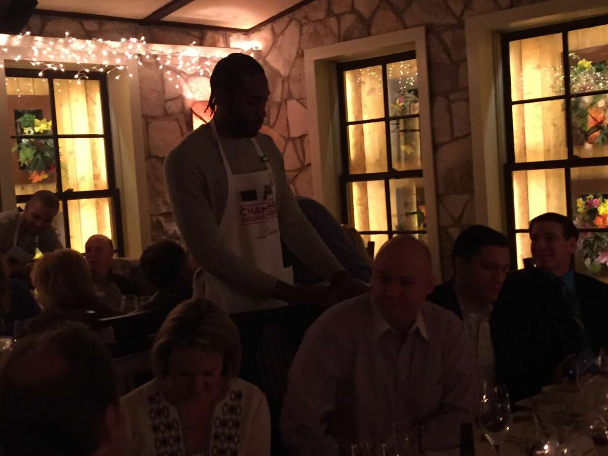Spurs' coach Gregg Popovich and his team were servers for a night to raise money for the San Antonio Food Bank.