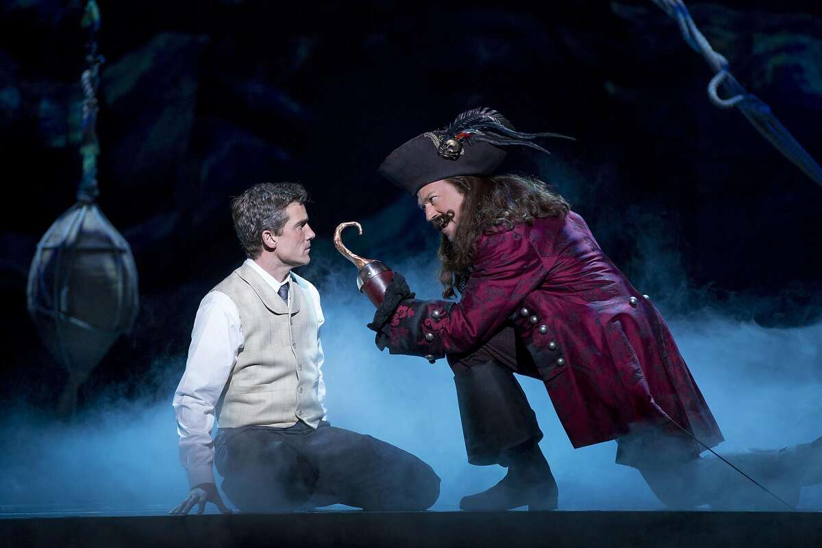 Kevin Kern as JM Barrie and Tom Hewitt as Captain Hook in SHN's "Finding Neverland."
