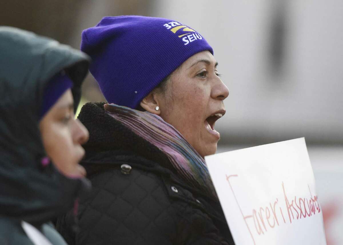 Lucia Perez, of Port Chester, N.Y., shouts during the protest outside Greenwich Office Park in Greenwich, Conn. Monday, Jan. 16, 2017. Former cleaners at Greenwich Office Park are demanding that Fareri Associates reinstate the 11 employees whom the building owners displaced from their jobs. On Nov. 4, the building owners ended their relationship with a cleaning contractor and did not rehire many of the workers left without jobs. The National Labor Relations Board is now investingating Fareri Associates for unfair labor practices.