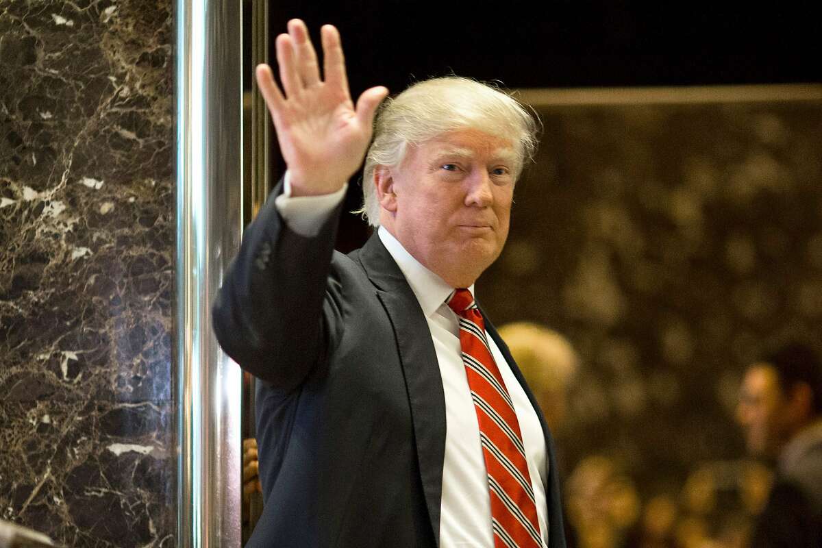 US President-elect Donald Trump waves toward the media after meeting Martin Luther King III at Trump Tower in New York City on January 16, 2017. The eldest son of American civil rights icon Martin Luther King Jr. met with US President-elect Donald Trump on the national holiday observed in remembrance of his late father. / AFP PHOTO / DOMINICK REUTERDOMINICK REUTER/AFP/Getty Images