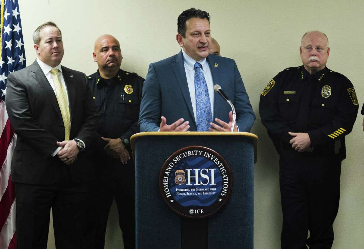 Flanked by members of various law enforcement organizations, Harry Jimenez, HSI Special Agent In Charge, answers questions during a press conference about human trafficking, Tuesday, Jan. 17, 2017, at a Homeland Security Investigations location in Windcrest. (Darren Abate/For the Express-News)