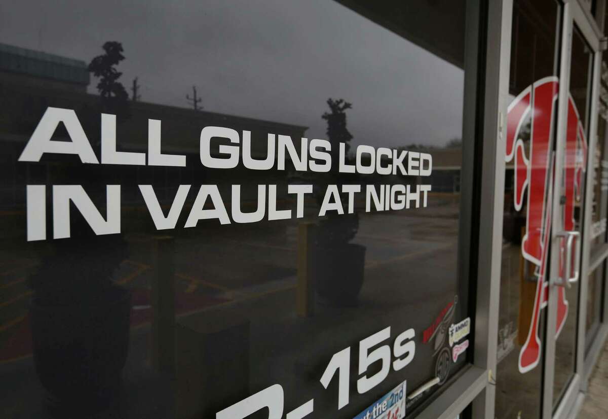 An attempted burglary happened at Full Armor Gun Range shortly after midnight and two gun shop employees exchanged fire with the suspects Tuesday, Jan. 17, 2017, in Houston. The store has signs reading "All guns locked in vault at night" and "Brick wall behind glass" all over the shop. ( Yi-Chin Lee / Houston Chronicle )