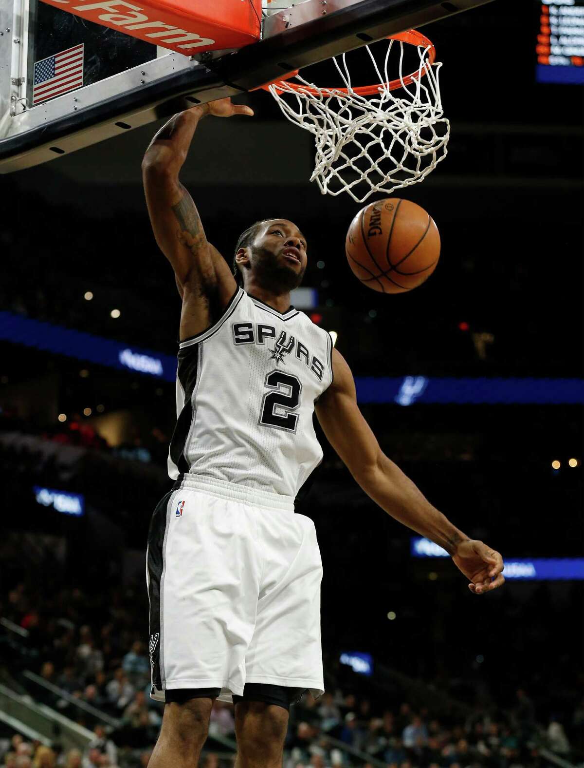 Spurs' Kawhi Leonard (02) gets an unopposed dunk against the Minnesota Timberwolves during their game at the AT&T Center on Tuesday, Jan. 17, 2017.