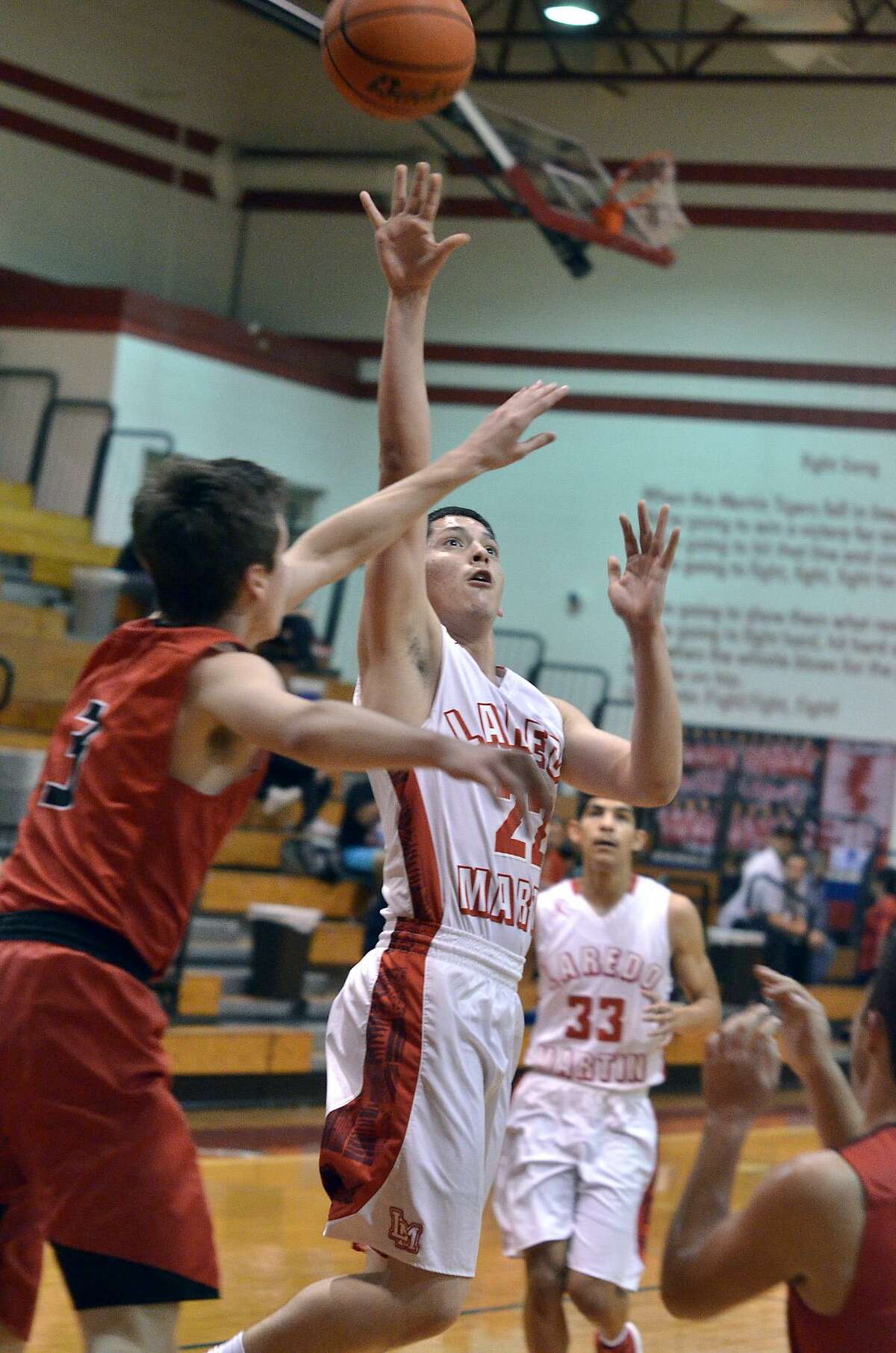 Martin’s Kevin Zamora scored nine points and dished out six assists as the Tigers remained perfect in District 31-5A at 9-0.