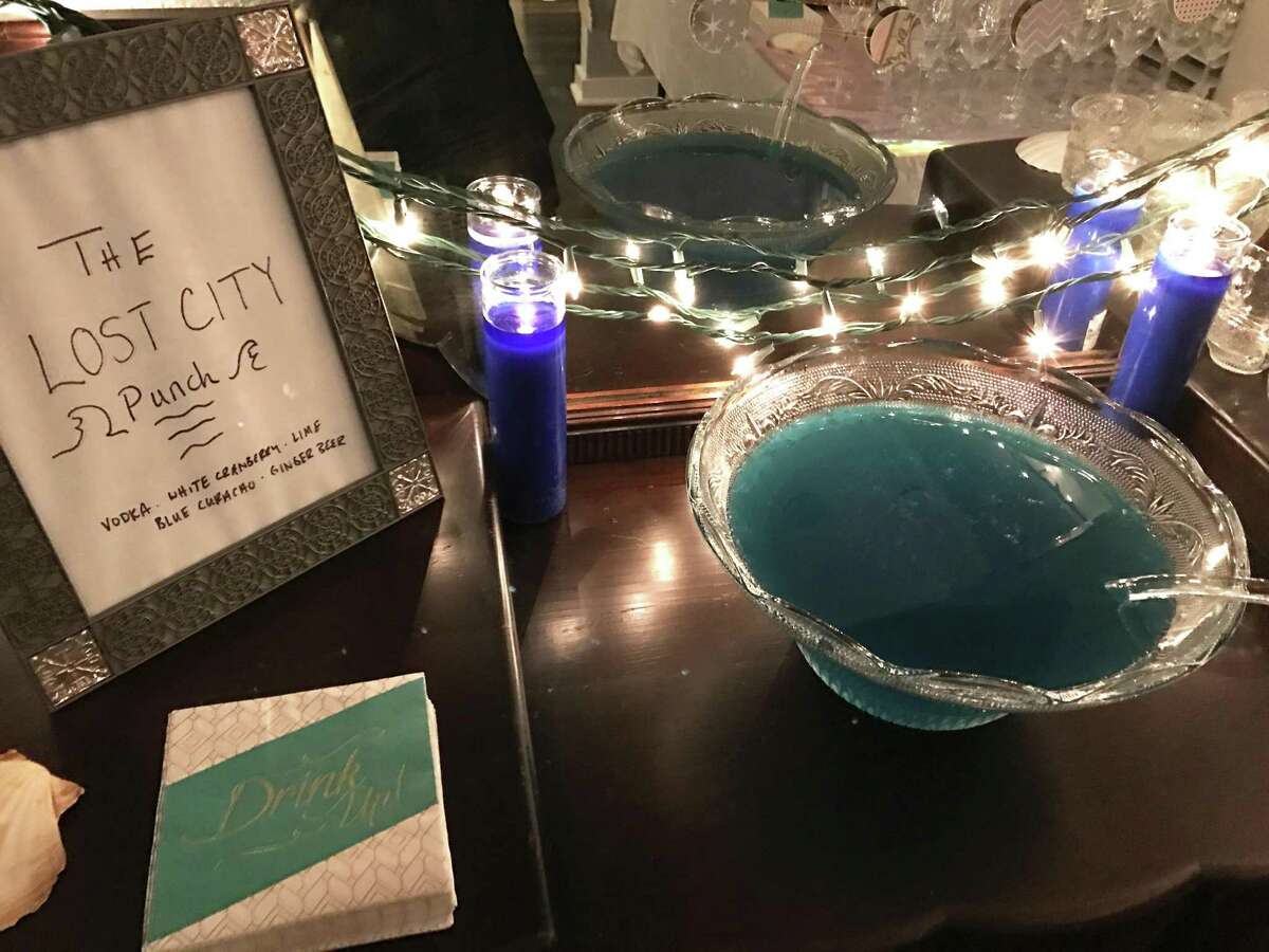 Make a big strong punch to welcome guests when they arrive. And label it, so they know what they're about to imbibe. At a recent Atlantis-themed cocktail party at my house, a bowl of blue martinis (renamed Lost City Punch for the occasion) did nicely.