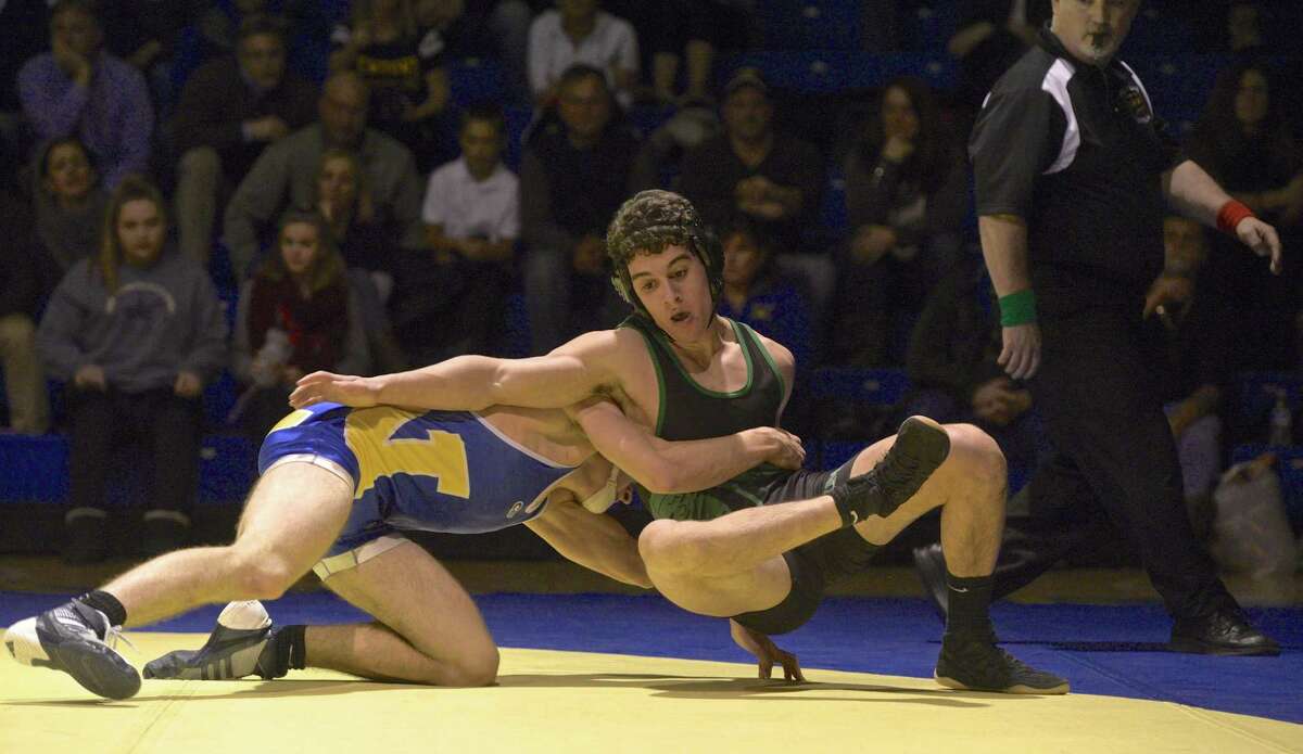 New Milford's Vincent Rago and Newtown's Owen Walsh wrestle in the 145 lb weight class during the SWC high school wrestling match between New Milford and Newtown high schools on Wednesday night, January 11, 2017, at Newtown High School, in Newtown, Conn.