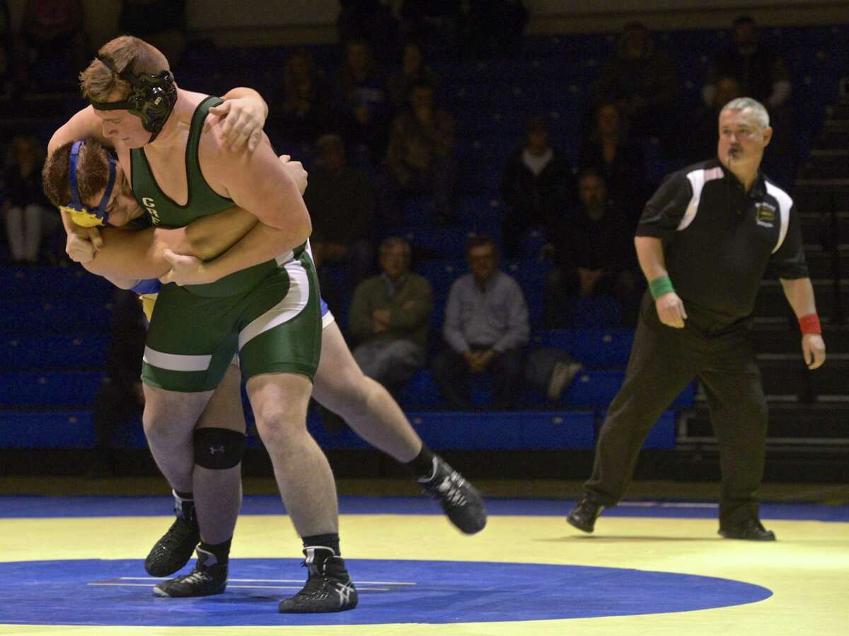 New Milford's Nick Boreck and Newtown's Joe Zeller wrestle in the heavy weight class during the SWC high school wrestling match between New Milford and Newtown high schools on Wednesday night, January 11, 2017, at Newtown High School, in Newtown, Conn.