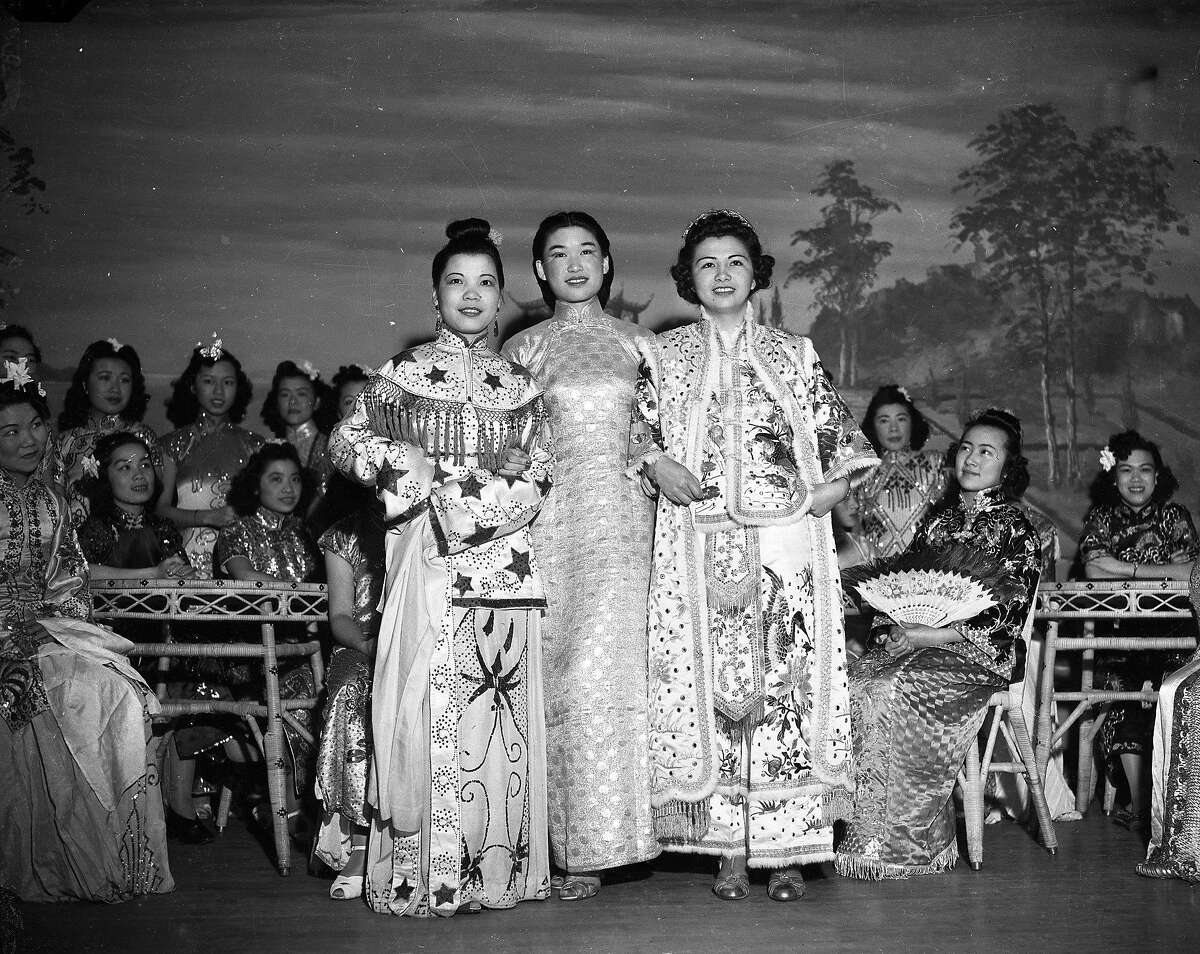 Historic Chinese fashions at the Chinatown Rice Bowl Party & Parade 1940. (L to R) Rose Lum in a costume from the Tang Dynasty. Doreen Feng (c) played the part of hostess, Miss Babette Lau (right)