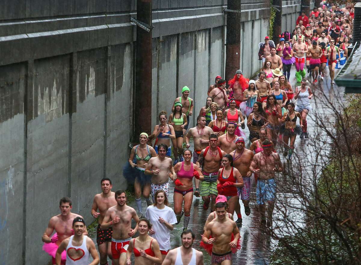 Participants run on the Burke-Gilman Trail during the third annual Cupid's Undie Run on Saturday, February 15, 2014 in Seattle's Fremont neighborhood. The 1K run, walk and party helps money for the Children's Tumor Foundation. It also serves as an excuse for people to show off their nicest underwear. (Joshua Trujillo, seattlepi.com)