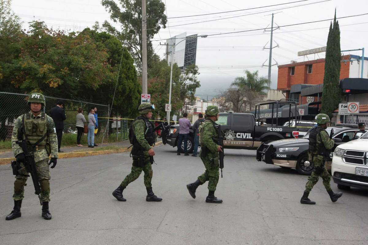 Members of the Mexican Army are deployed outside a high school where a student opened fire on his classmates in Monterrey, Mexico, on January 18, 2017. A high school student shot his teammates at a college in Monterrey, an industrial city in northeastern Mexico, in an unprecedented event that left five people injured, including the assailant who attempted suicide, authorities in the state of Nuevo Leon reported. / AFP PHOTO / Julio Cesar AGUILARJULIO CESAR AGUILAR/AFP/Getty Images