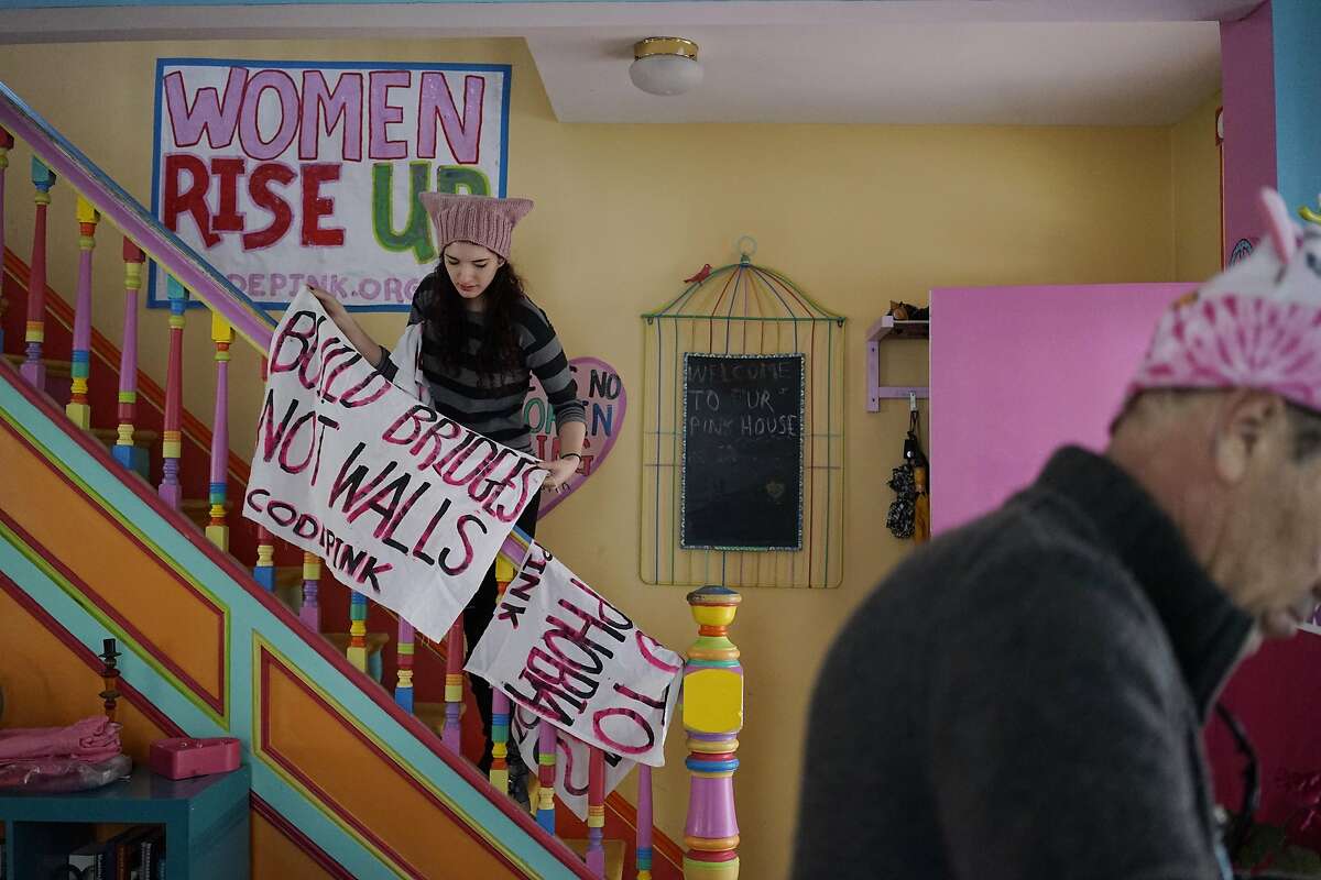 Brienne Kordis, of Washington DC hangs protest banners to dry at the Code Pink House in Washington D.C. office on Wednesday January 18, 2017.