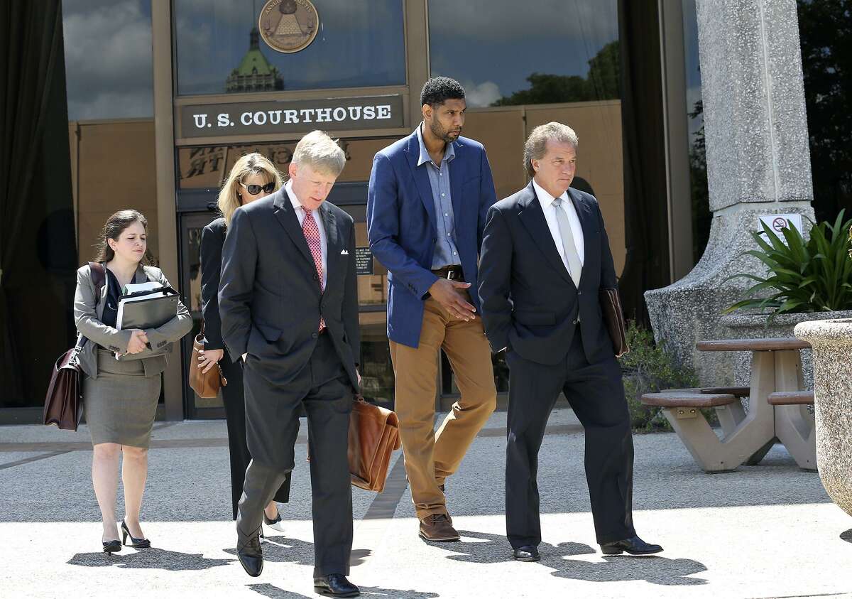 Tim Duncan exits proceedings with his legal team after he makes an appearance in federal court before U.S. District Judge Xavier Rodriguez regarding his lawsuit against Charles Banks on June 10, 2015. From left are attorney Jacqueline Garza-Rothrock, consultant Wendy Kowalik, attorney J. Tullos Wells, Duncan and attorney Michael D. Bernard.