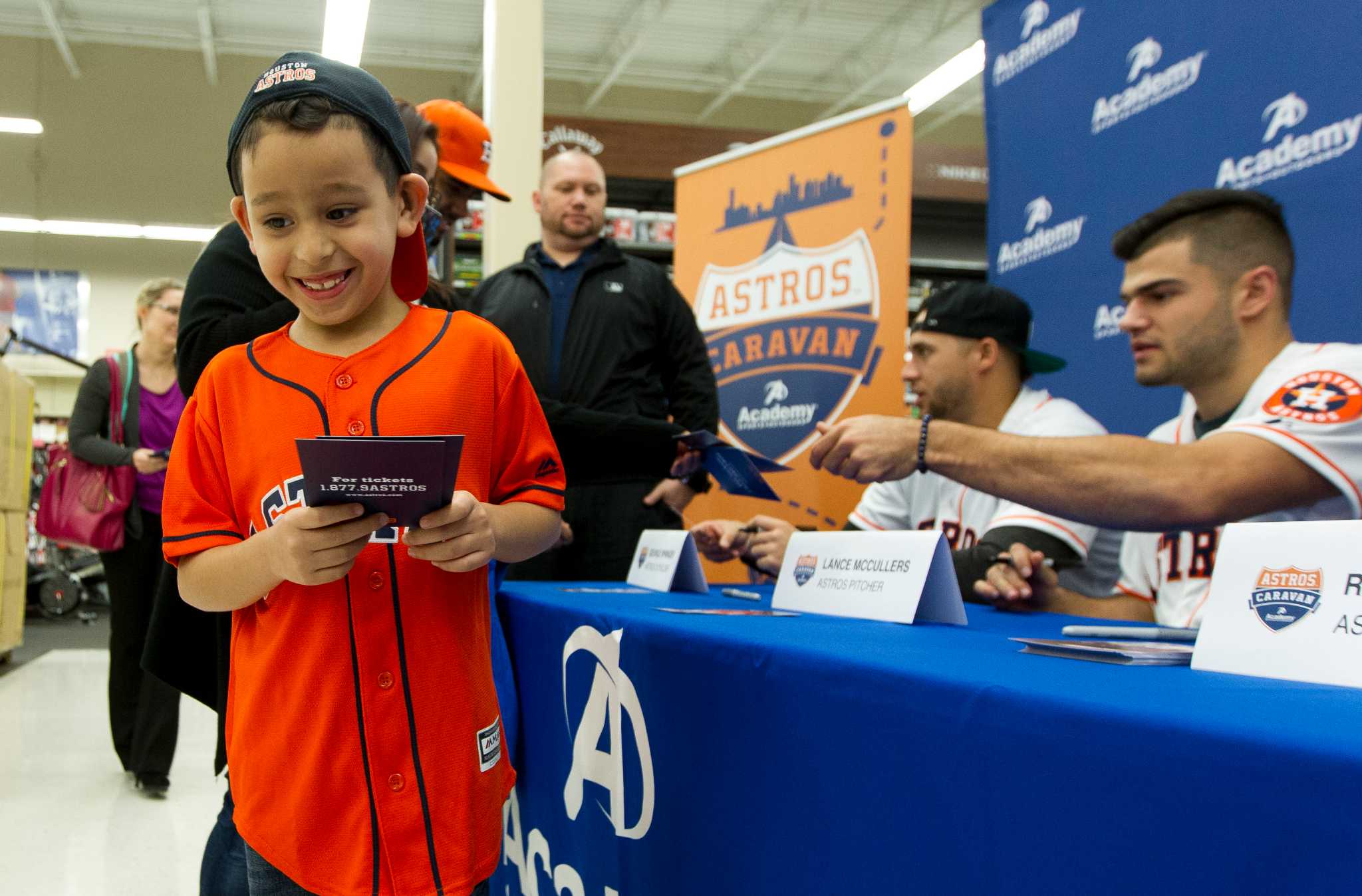 Houston Astros players shop with kids at Academy during Astros-Caravan stop