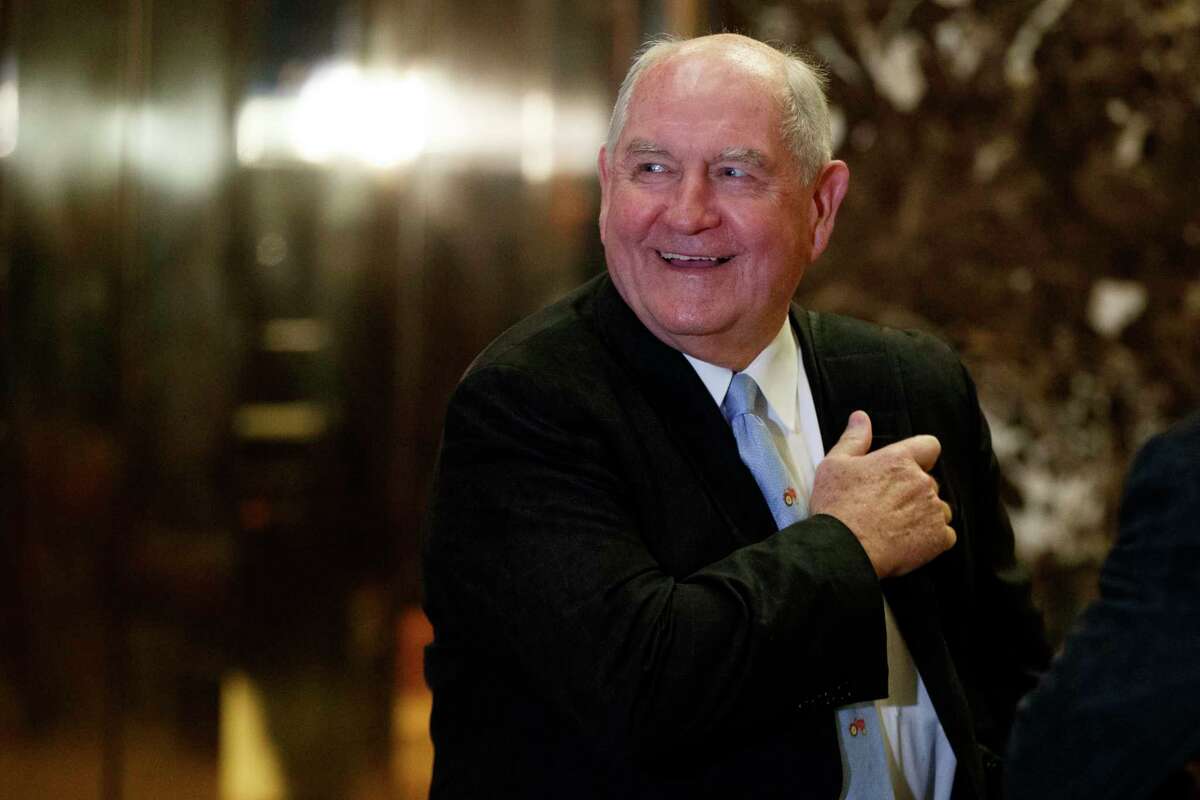 FILE- In this Nov. 30, 2016, file photo, former Georgia Gov. Sonny Perdue smiles as he waits for an elevator in the lobby of Trump Tower in New York. A person familiar with the decision says President-elect Donald Trump has chosen Perdue to serve as agriculture secretary. (AP Photo/Evan Vucci, File)