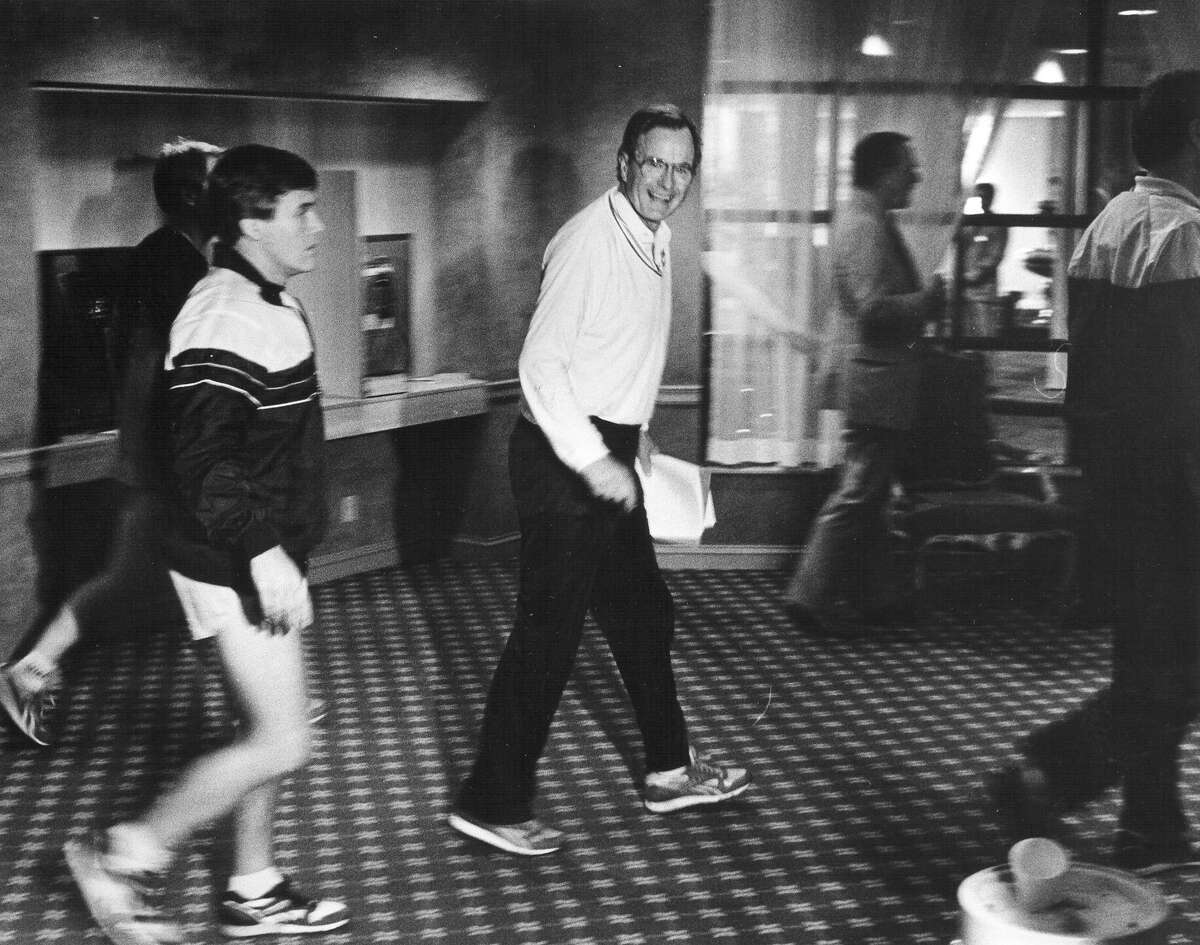 Vice President George H.W. Bush returns to the St. Anthony's Hotel after a morning jog on March 24, 1987. San Antonio Express-News file photo