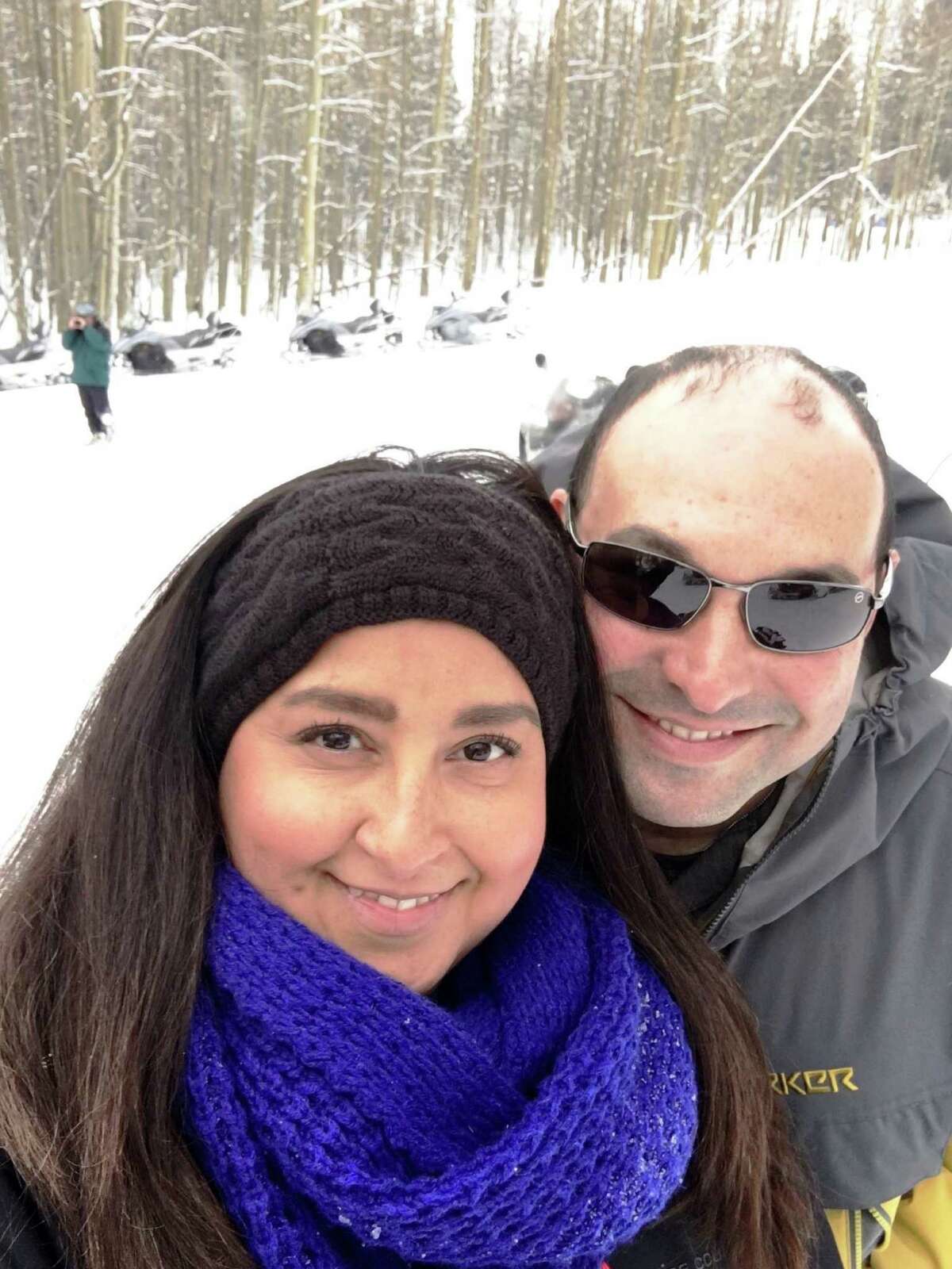 Laurie and Robert Plumas pose while snowmobiling during the 2016 honeymoon to the Lake Tahoe area. The San Antonio couple raised money to pay for most of their honeymoon on the crowdfunding website Honeyfund.