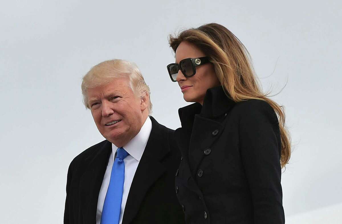 President-elect Donald Trump and his wife, Melania, step off a plane upon arrival at Andrews AFB in Maryland the day before his inauguration as president. Russian magnates and American investors alike are anticipating a Trump administration that removes punishing sanctions, frees up access to capital and encourages U.S. businesses pursuing profits in Russia’s vast market — regardless of Russian President Vladimir Putin’s policies.